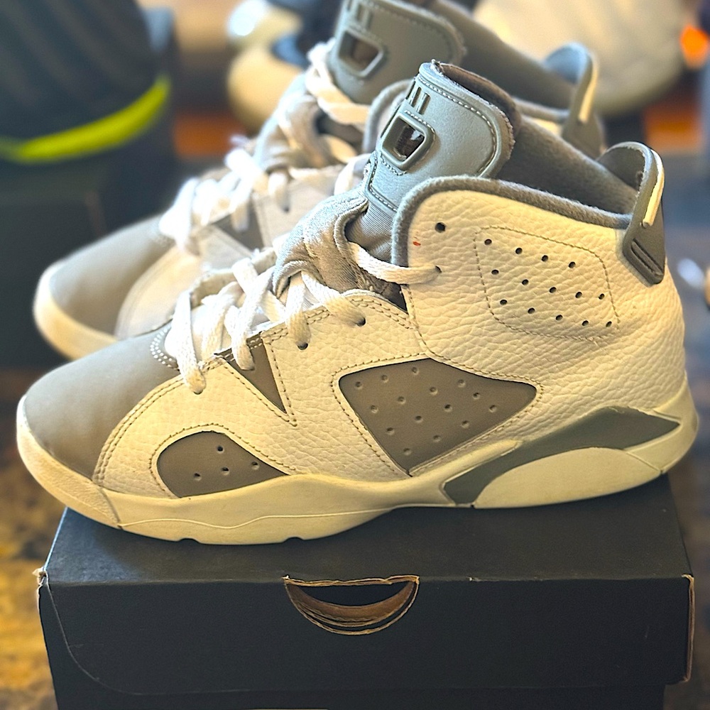 Air Jordan Cool Gray 6’s in a youth size 1.5 in the colors gray and white